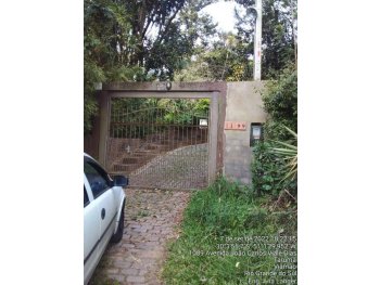 Foto de Casa em leilão no bairro Tarumã em Viamão - RS