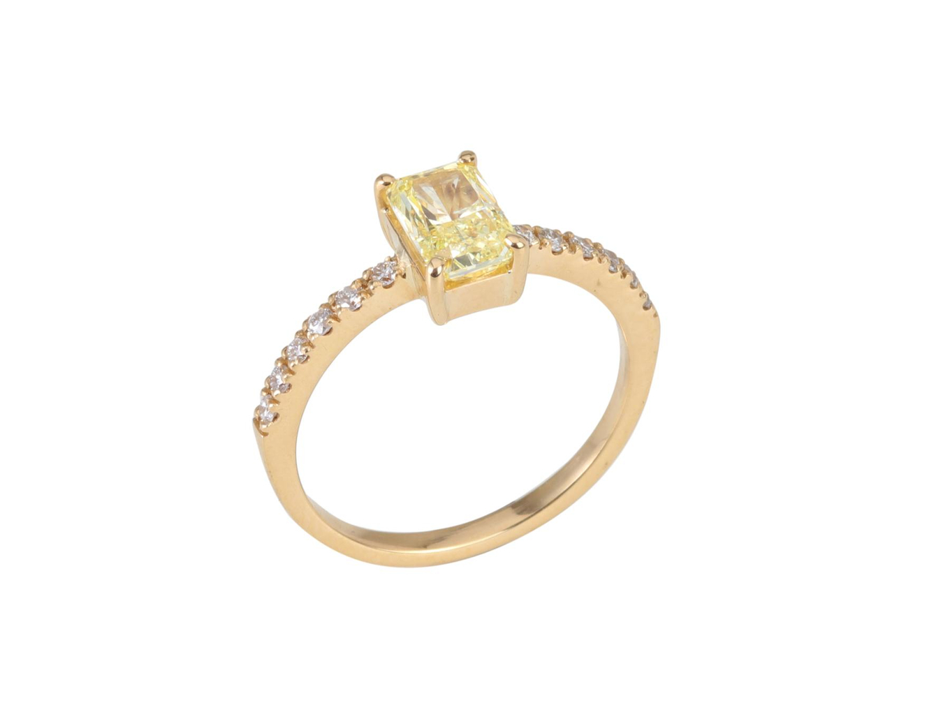 Foto de Anel de ouro amarelo 18k e diamantes. Central Fancy Yellow lapidação radiante regulando 1,50ct. Cerca de 2,6g. Medida 15/16.