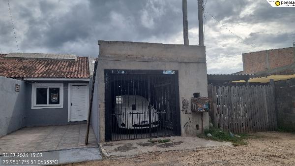 Foto de Casa em leilão no bairro Maria Regina em Alvorada - RS